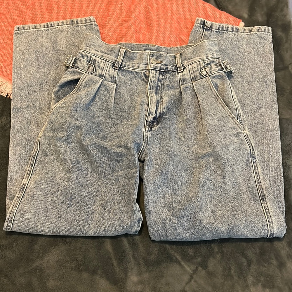 Worn. denim mom jeans. side buckles. slightly high waisted.